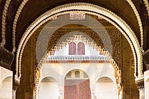 Ornate arches of the courtyard of Alhambra, Granada, Spain photo