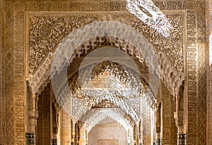 Ornate arches in a  Lions patio of Alhambra, Granada, Spain