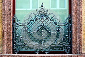 Ornate and artistic old wrough iron window balustrade and grill