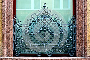 Ornate and artistic old wrough iron window balustrade and grill photo