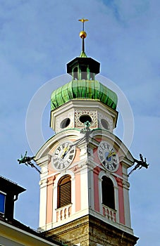 Ornate bell tower of the Hospital Church of the Holy Spirit in Innsbruck, Austria