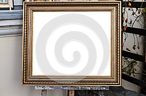 Ornate blank frame on the Easel in outside Art Gallery, White Is