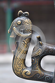 Ornate brass fittings handle of a mythical creature