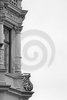 Ornate carved building exterior with balcony against negative space