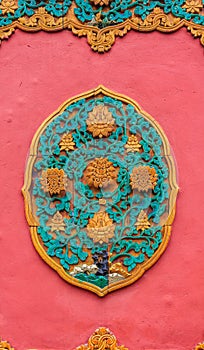 Ornate ceramic ornament on the wall in Forbidden City in Beijing