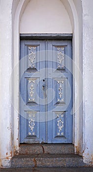 Ornate chapel door in historical city of Serro, Brazil photo