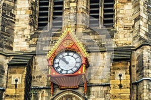 The ornate clock on the exterior of St. Nicholas Cathedral, or Newcastle Cathedral in the historic city of Newcastle