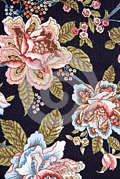 Ornate colorful floral tapestry on black photo