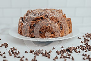 An ornate and decorative homemade and fresh chocolate chip bundt cake