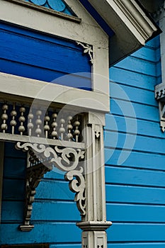Ornate details of blue and white Victorian house