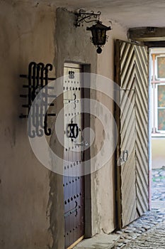 Ornate door and lantern in passageway