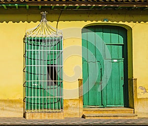 Ornate door in old town of Trinidad listed on UNESCO World Heritage List, colonial architecture.