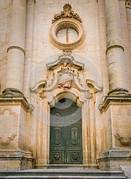 Ornate door to the Duomo of San Giorgio in Modica, fine example of sicilian baroque art. Sicily, southern Italy.