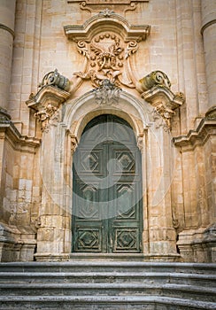 Ornate door to the Duomo of San Giorgio in Modica, fine example of sicilian baroque art. Sicily, southern Italy.