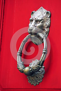 Ornate doorhandle depicting lion portrait.