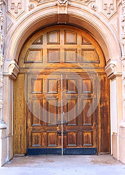 Ornate entrance with old wooden door photo