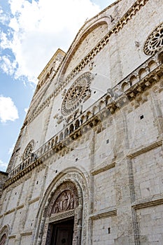 Ornate facade of the Duomo Cathedral of San Rufino in Assisi, Umbria, Italy