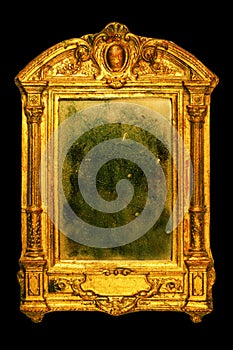 Ornate frame with dusty mirror