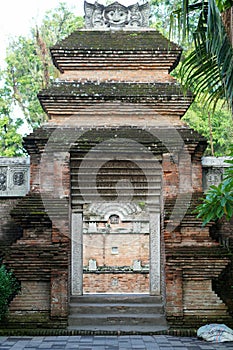 An ornate gate at a cultural heritage cemetery in Yogyakarta, made from red brick photo