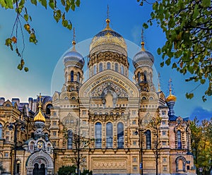 Ornate golden domes and crosses of the Russian Orthodox Church of the Assumption of Mary in Saint Petersburg Russia