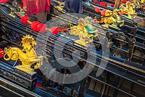 Ornate Gondolas detail in Grand Canal pier at sunny day, Venice, Italy