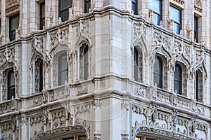 Ornate gothic architectural details of the Woolworth Building window crowns on Broadway in Tribeca Manhattan, New York