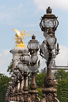 Ornate lampposts on Alexander III bridge in Paris