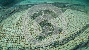 Ornate mosaic in villa protiro. Underwater archeology.