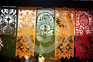 ornate paper cutouts papel picado with intricate patterns