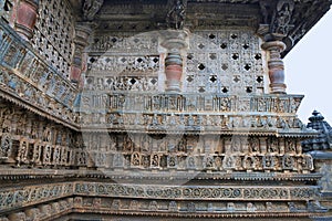 Ornate perforated window and Decorative friezes with deities, dancers and other figures, Chennakeshava temple. Belur, Karnataka.
