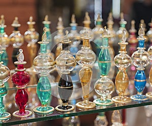 Ornate perfume bottles on a shelf