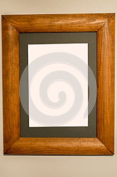 Ornate picture wooden frame on the white wall Blank White Isolated Clipping Path