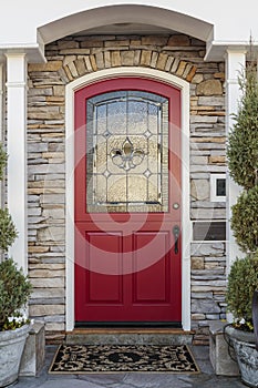 Ornate red front door of a home