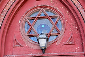 Ornate, reuleaux window and lamp, church, downtown Keene, New Ha