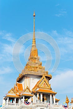 Ornate Roof and Spire of Wat Traimit in Bangkok, Thailand photo