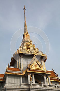 Ornate roof tops decorated with gold of the Wat Trimit temple in Chinatown, Bangkok, Thailand