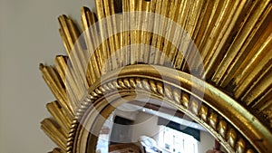 Ornate starburst retro gold mirror