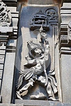 Ornate wall panel reliefs depicting Arjuna shooting arrow in the fish eye, Chennakesava temple, Belur, Karnataka.