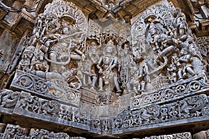 Ornate wall panel reliefs depicting dancing Shiva on the left and dancing Sarswati on the right, Hoysaleshwara temple, Halebidu, K