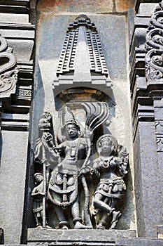 Ornate wall panel reliefs depicting Kamadeva and his consort Rati, Chennakesava temple, Belur, Karnataka.