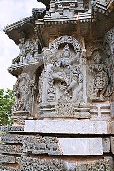 Ornate wall panel reliefs depicting Krishna dancing on the head of serpant Kalia and eventually killing him. Kedareshwara temple,