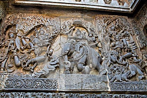 Ornate wall panel reliefs depicting from left Garuda carrying Vishnu, Lord Indra and Indrani on elephant Eirawat and Vishnu rescui