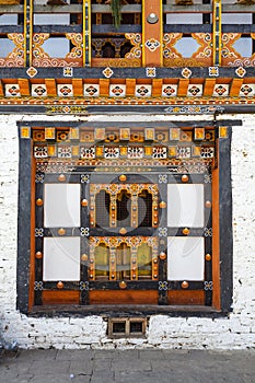 Ornate window and balcony inside of Mongar Dzong monastery in Mongar, Bhutan