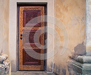 Ornate wooden brown door on a Church