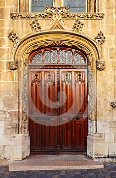Ornate wooden double door entrance to an old church