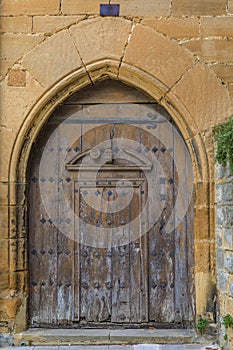 Ornate wooden gate with metal accents in old town Casco Viejo in Pamplona, Spain