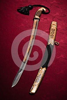 Ornated sword on red
