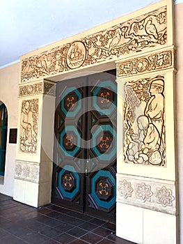 Ornately carved antique doors and door frame photo