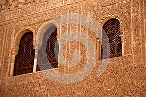 Ornately decorated windows at the Nasrid Palace, Alhambra, Granada, Spain.