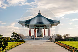 Ornately designed Korean Bell of Friendship in a lush, green park